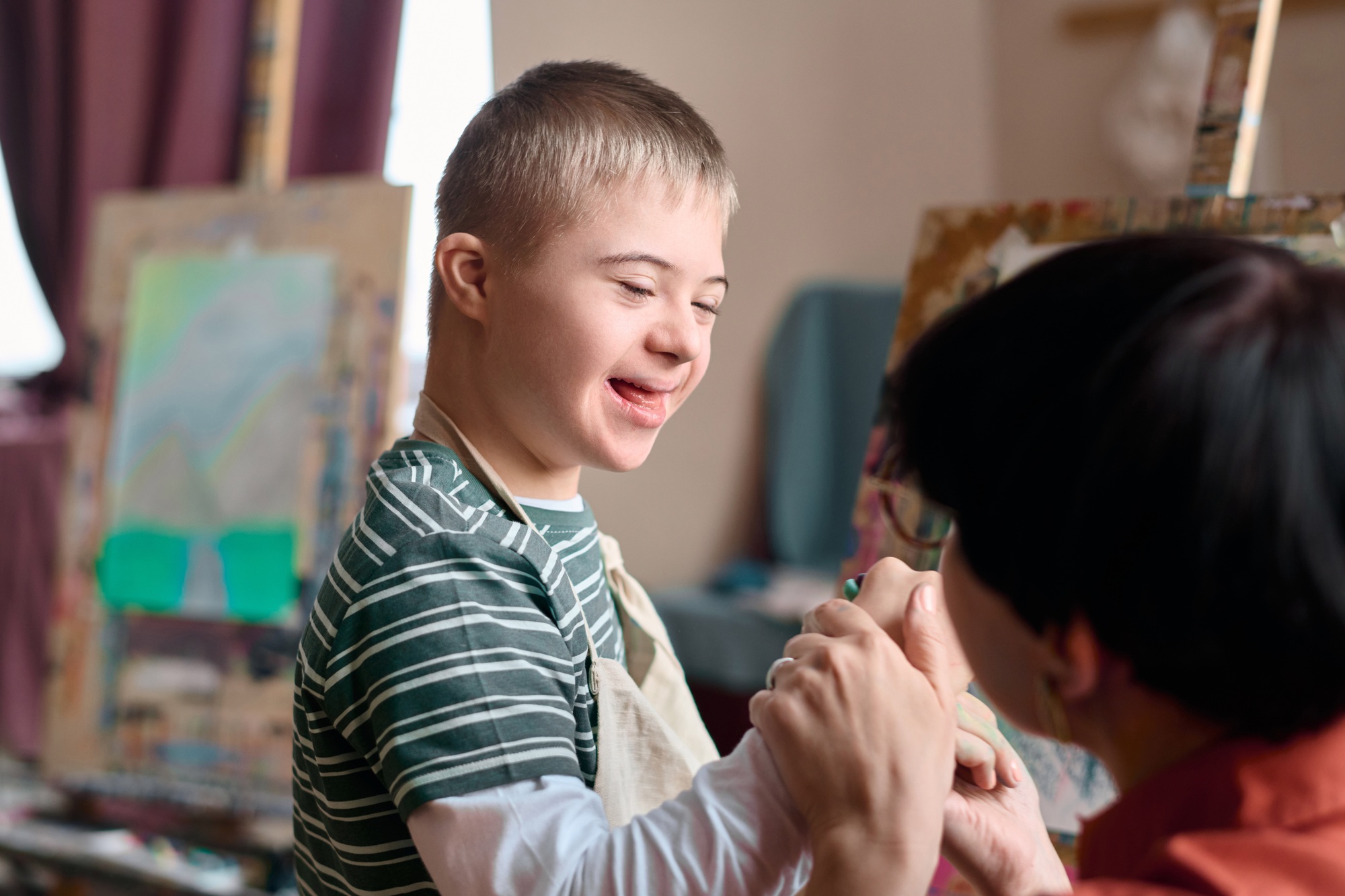 Boy with Down Syndrome Enjoying Art Class