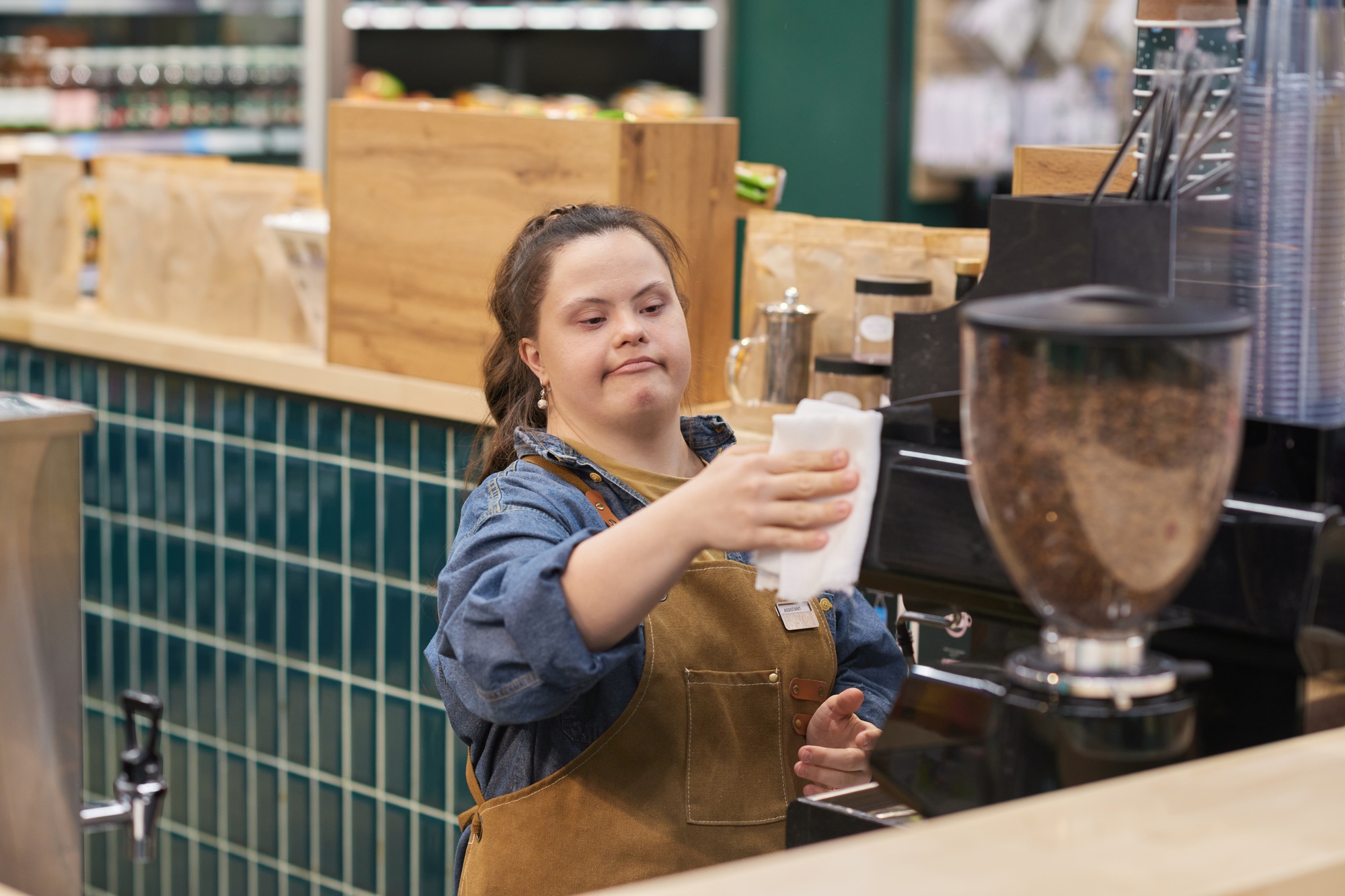 Girl with Down Syndrome Working As Barista in Cafe
